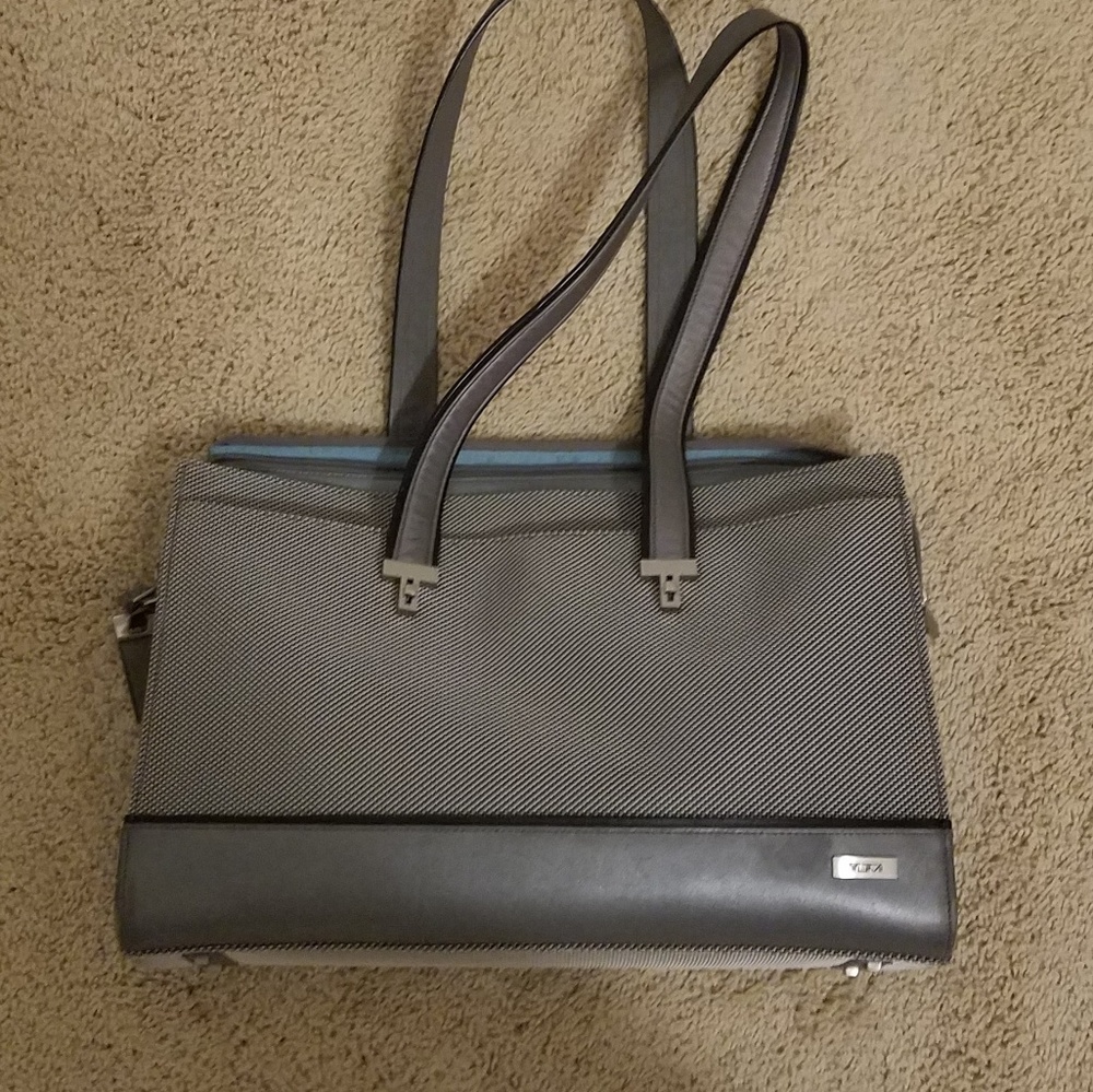 TUMI briefcase or tote bag.